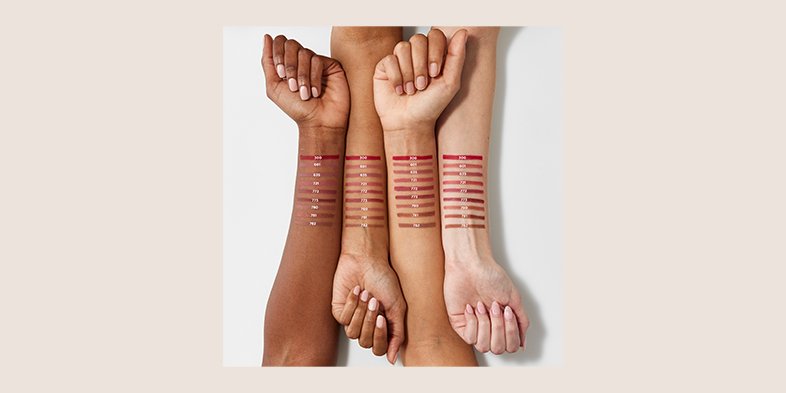 Women with different lipstick shades in their forearm